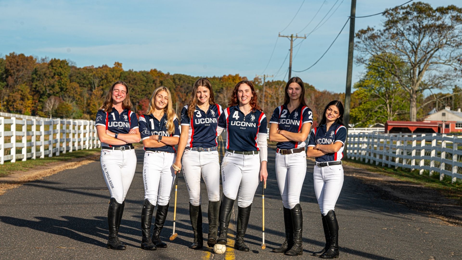 The women's polo team poses together for a photo